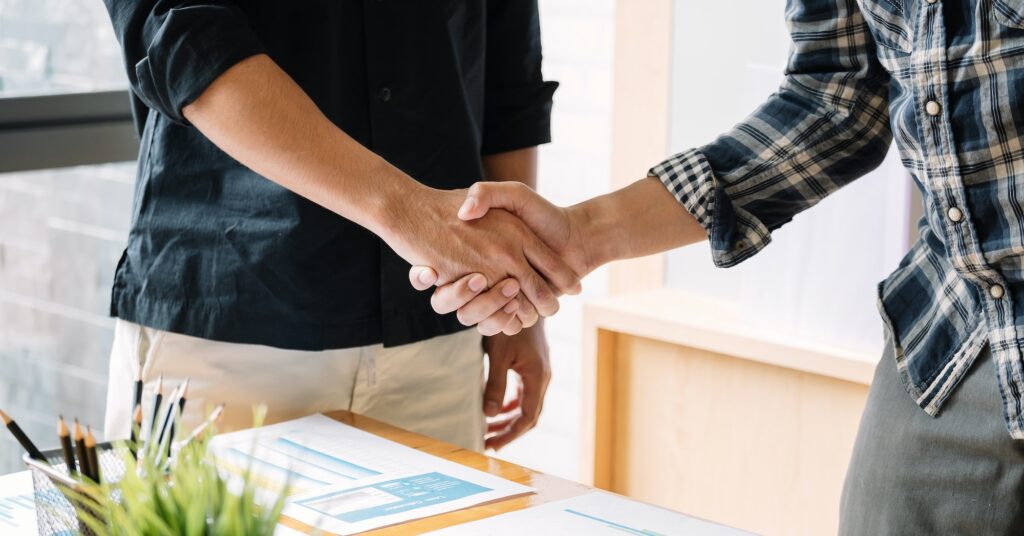 business people handshake for teamwork of business merger and acquisition